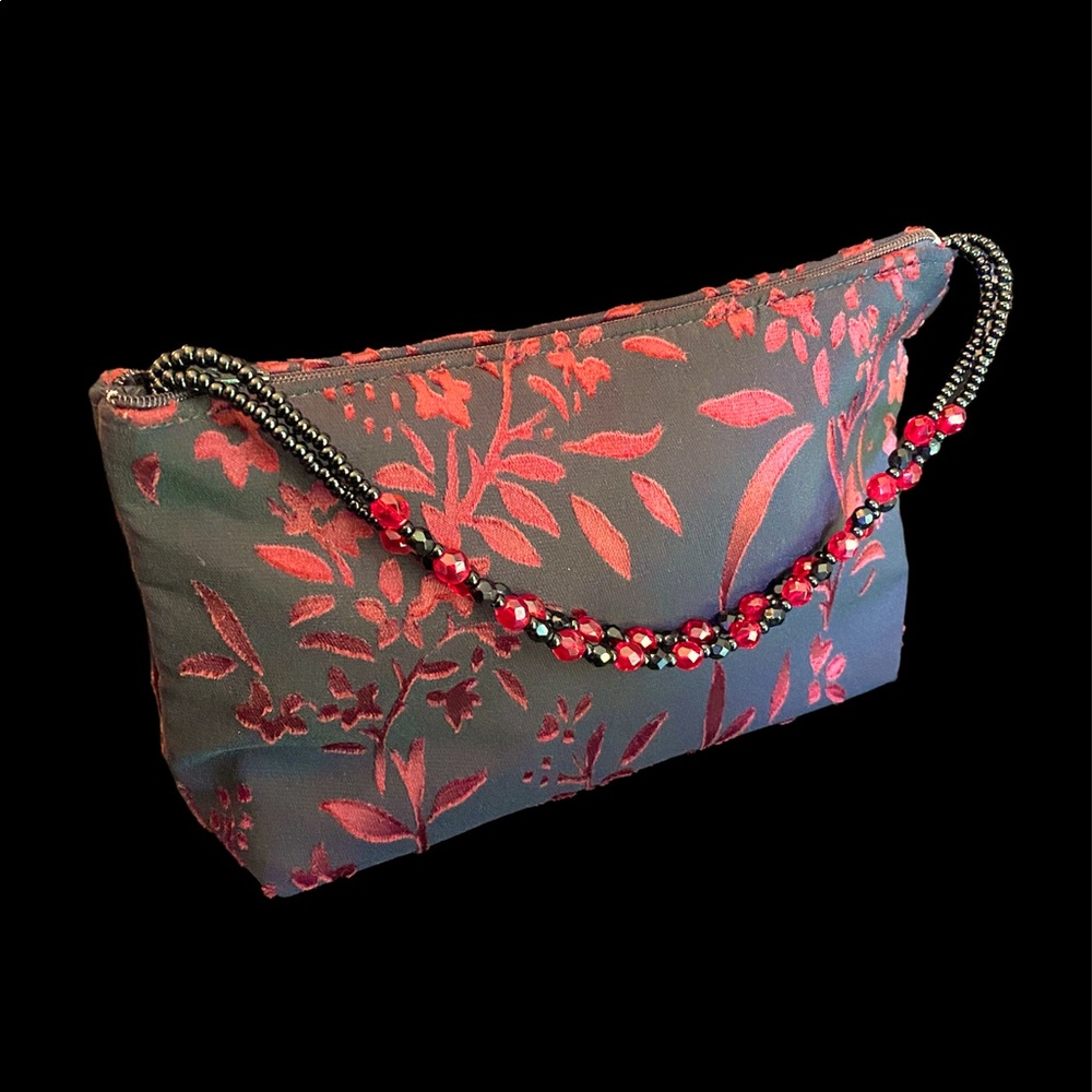 Elegant evening bag with hand beaded glass bead double strap.